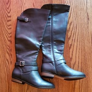 Knee high black boots. NWT